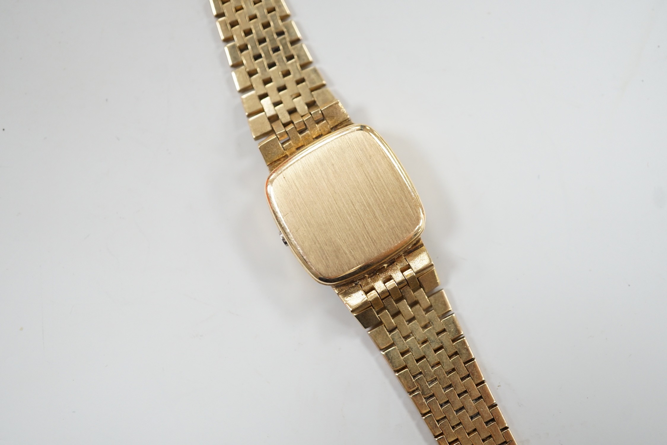 A lady's 9ct gold Omega quartz wrist watch, on a 9ct gold Omega bracelet, overall 17.3cm, gross weight 29 grams, with Omega box and booklet.